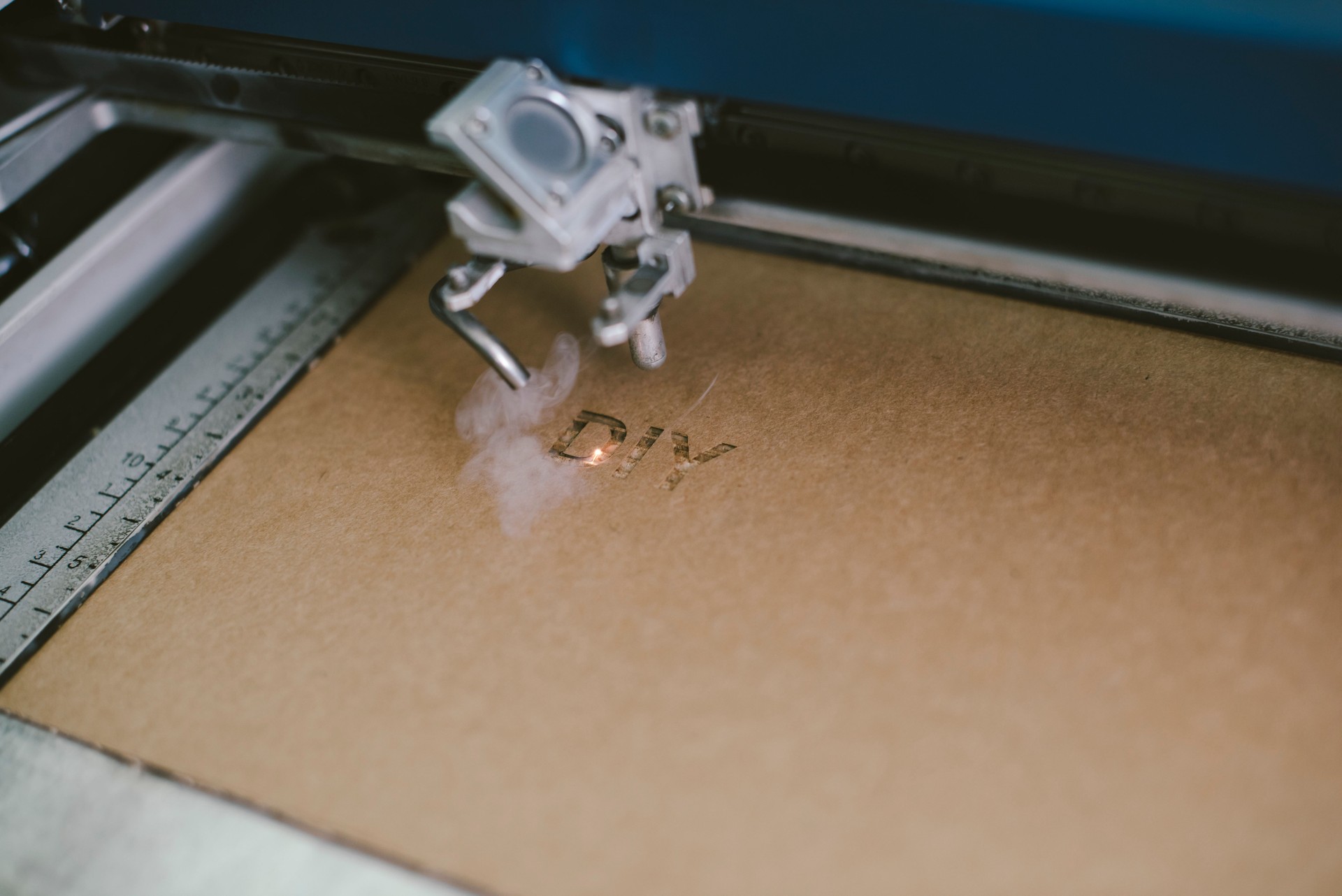 Laser engraving DIY word on recycle cardboard